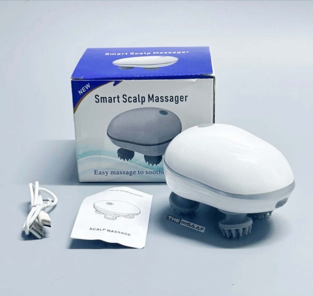 White handheld electric scalp massager device box on a wooden surface