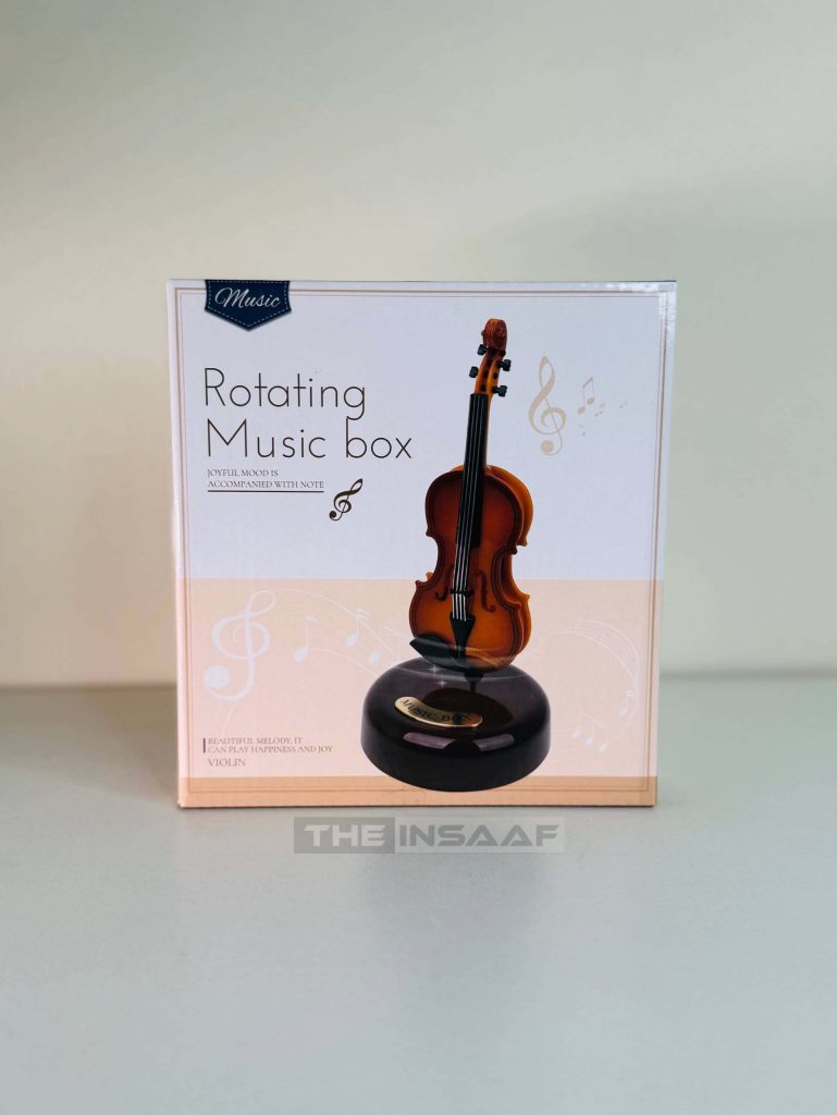 Classic rotating violin music box on round base⁠